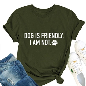 Flat lay of army green Dog Is Friendly t-shirt with blue ripped jeans and white sneakers