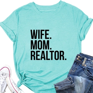 Flat lay of mint green Wife Mom Realtor t-shirt paired with jeans and canvas shoes