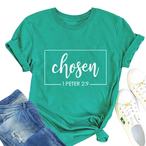 Flat lay of a mint green cotton T-shirt with 'chosen 1 PETER 2:9' text and denim jeans