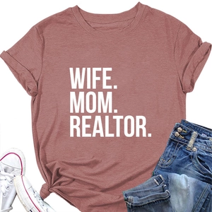 Flat lay of Wife Mom Realtor t-shirt in brick red with rolled sleeves and knotted hem detail