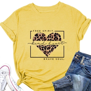 Close-up of yellow cotton t-shirt featuring leopard heart print and free spirit slogans
