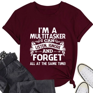 Detail of burgundy T-shirt with white slogan, side knot design, and cuffed sleeves