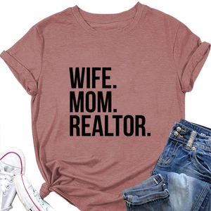 Flat lay of a dusty rose cotton T-shirt featuring 'WIFE MOM REALTOR' black text