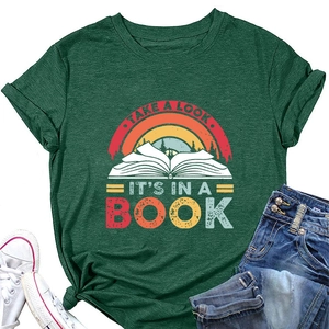Flat lay of forest green t-shirt with retro book print, sneakers, and blue denim jeans