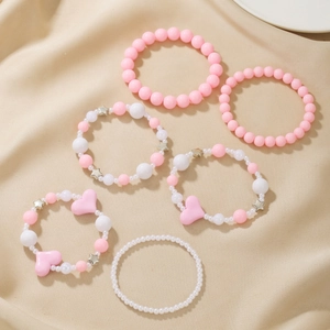Handgefertigtes rosa-weißes Perlenarmband-Set mit Herz- und Sternanhängern