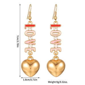 Detail view of LOVE heart drop earrings with pink enamel, rhinestones and size measurements