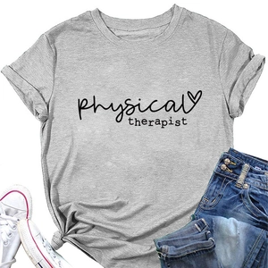 Flat lay of a grey physical therapist t-shirt with heart graphic and denim jeans