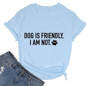 Detail of light blue T-shirt featuring DOG IS FRIENDLY print and stylish knot on the hem