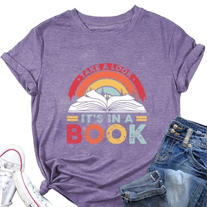 Detail of purple t-shirt showing the vintage rainbow and book print with cutout text