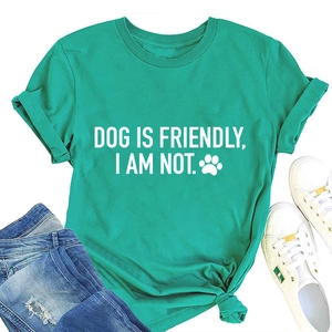 Close-up of Dog Is Friendly graphic T-shirt with rolled sleeves and knotted hem detail