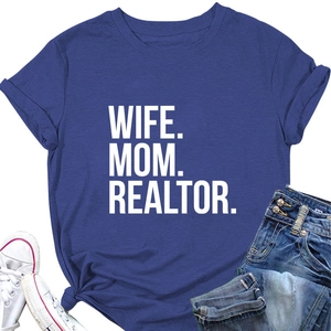 Flat lay of navy blue Wife Mom Realtor t-shirt with jeans and white canvas shoes