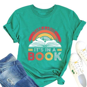 Close-up of reading-themed graphic on a mint green t-shirt with flat lay accessories