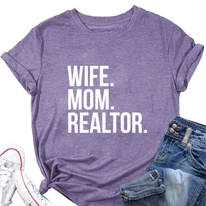 Detailed view of purple slogan t-shirt with Wife Mom Realtor text and denim jeans