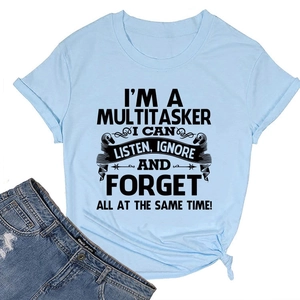 Flat lay of light blue cotton T-shirt with black humor text print and denim shorts