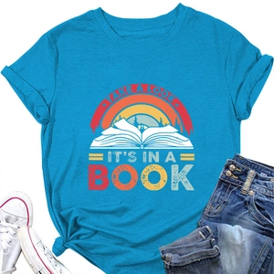 Flat lay of blue T-shirt featuring vintage rainbow book print and slogan lettering