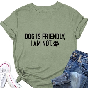 Flat lay of bean green cotton T-shirt with 'DOG IS FRIENDLY' print and jeans