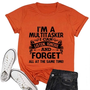 Flat lay of an orange crew neck cotton T-shirt with black I'M A MULTITASKER print