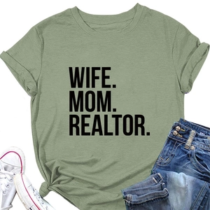 Flat lay of sage green T-shirt with WIFE MOM REALTOR text, canvas shoes and jeans