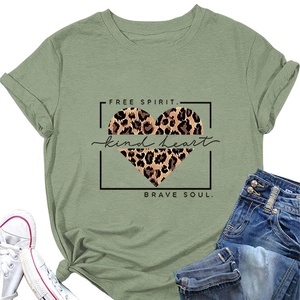 Detail of green cotton T-shirt featuring leopard heart print and inspirational text slogan