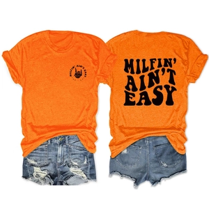 Detailed back view of orange Milfin' Ain't Easy T-shirt and distressed denim shorts