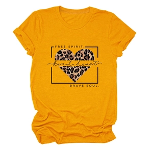 Close-up of leopard heart print with Free Spirit and Brave Soul text on yellow tee