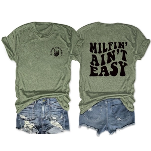 Detail of MILFIN' AIN'T EASY skull print on a heather green T-shirt and denim shorts