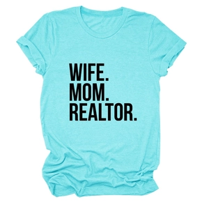 Close-up of turquoise cotton T-shirt featuring bold WIFE MOM REALTOR printed text