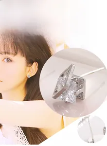 Close-up of geometric square zircon earrings with 925 sterling silver needle and stud details