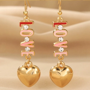 Golden LOVE earrings with red pink enamel hearts and crystals on beige silk