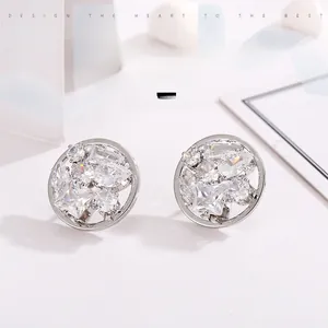 Macro shot of silver plated stud earrings with clusters of brilliant white zircon stones