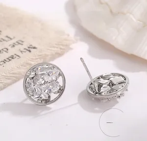 Macro shot of S925 sterling silver earrings with cluster of clear cubic zirconia stones