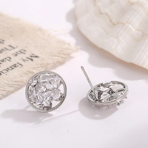 Macro view of S925 silver stud earrings with multi-shape zircon inlay and luster