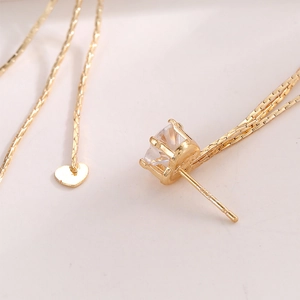 Elegante vergoldete S925 Silber Quastenohrringe mit Herzanhänger und funkelndem Zirkon