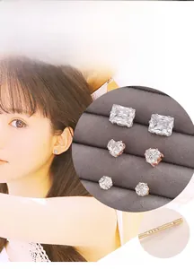 Detailed view of three cubic zirconia stud earrings with S925 sterling silver hallmark