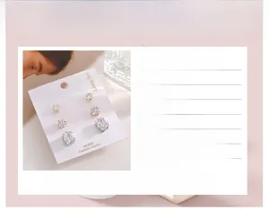 Detail of 3A zircon earring set with 925 silver posts in round, heart, and square shapes
