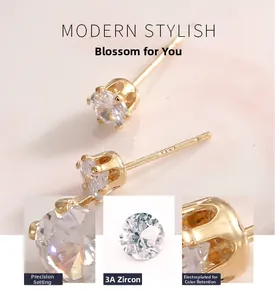 Detail of S925 silver stud earrings with 6-prong 3A cubic zirconia and gold plating
