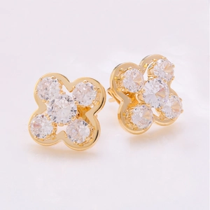 Boucles d'oreilles trèfle à quatre feuilles dorées avec pierres zircons étincelantes
