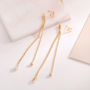 Elegant gold star and moon tassel drop earrings with sparkling cubic zirconia accents
