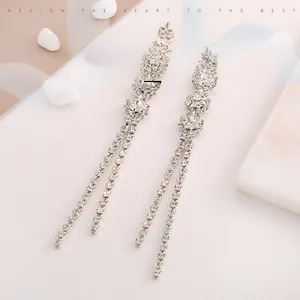 Detailed view of stainless steel snowflake tassel earrings with sparkling zircon fringe