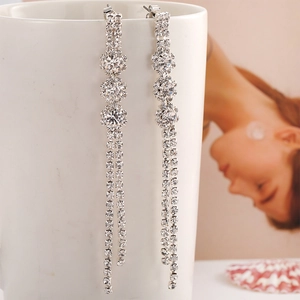 Elegant silver stainless steel snowflake drop earrings with long rhinestone tassels