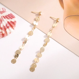 Elegant gold tassel earrings with shimmering round sequins and zircon stud detail