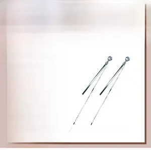 Detailed view of long tassel earrings featuring shiny cubic zirconia and 925 silver needles