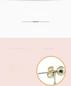 Close-up of golden spherical studs featuring S925 silver needles and butterfly clasps