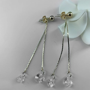 Long gold tassel earrings with glittering water-drop pendants and chain design