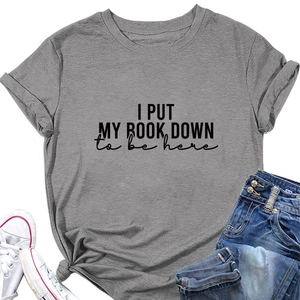 Detail of grey cotton T-shirt with I PUT MY BOOK DOWN print and stylish side knot design