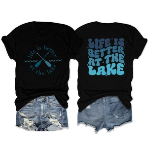 Detail view of cotton t-shirt with 'life is better at the lake' print and denim shorts