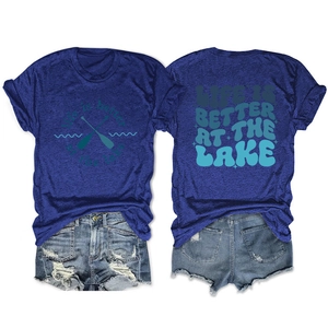 Detail view showing 'Life is Better at the Lake' print and vintage denim shorts