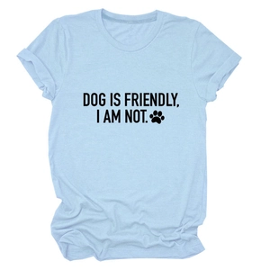 Detail of light blue cotton T-shirt featuring 'DOG IS FRIENDLY' text and cuffed sleeves