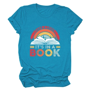 Close-up of vintage rainbow and open book print on teal cotton t-shirt fabric