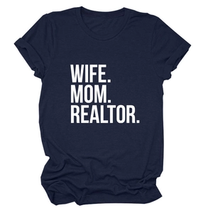 Close-up of navy blue T-shirt featuring bold white Wife Mom Realtor text print